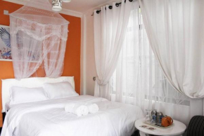 Orange-themed cozy, modern apartment